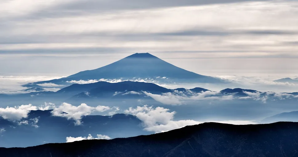 feeling drawn to someone you barely know spiritual meaning - mt fuji, volcano, silhouettes