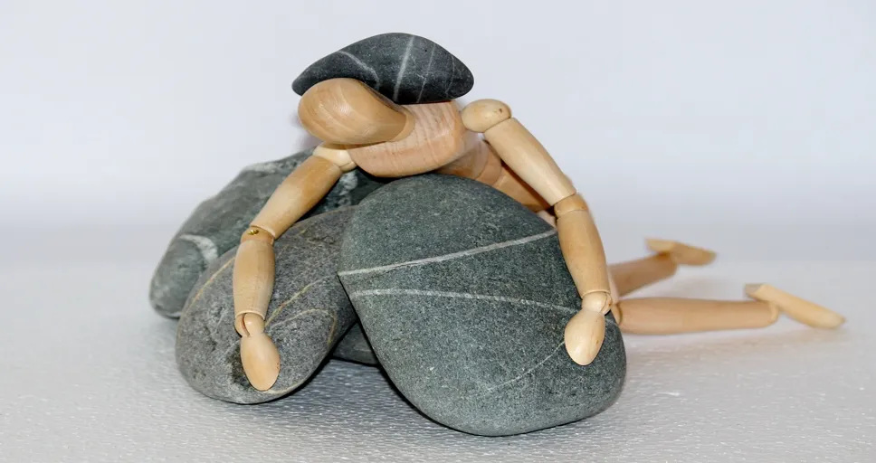 when a guy watches you sleep what does it mean - wooden figure, stones, struggle for life